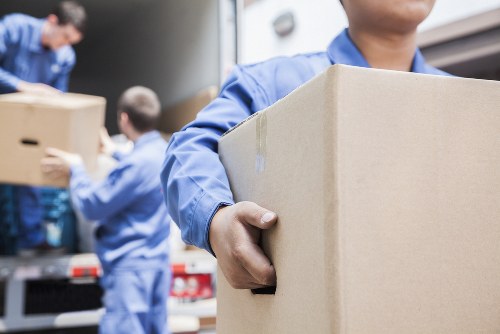 Furniture collection service helping a Berrylands resident with a bulky sofa