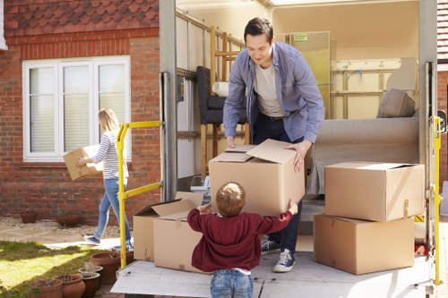 Removal van and packed boxes for a Berrylands house move