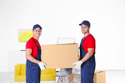 Professional moving truck loading boxes and furniture in Berrylands