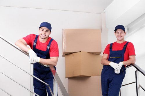 Moving van loading boxes and household items in Berrylands