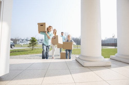 Professional movers loading household items for a Berrylands relocation