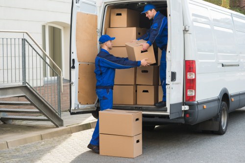 Careful loading of belongings into a van in Berrylands