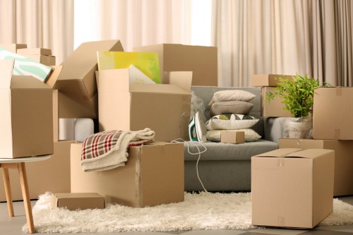 Loading furniture into a removals van near Berrylands