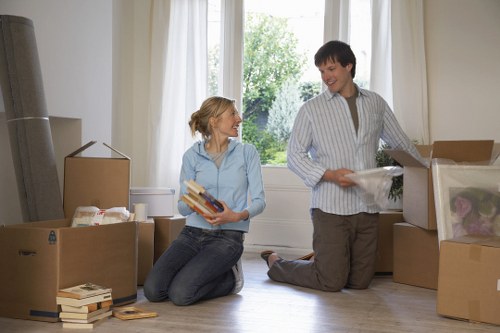 Packed boxes and furniture ready for transport during a Berrylands house move