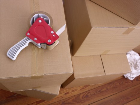 Movers loading office equipment for a Berrylands business move