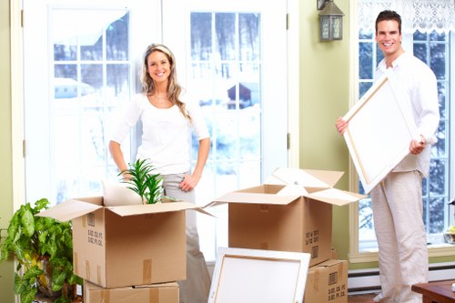 Loading business equipment carefully during a Berrylands relocation
