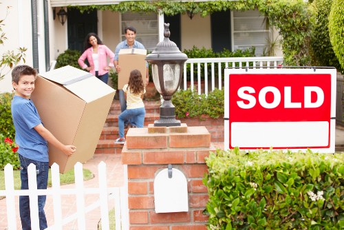 Packed boxes and furniture ready for a home move in Berrylands